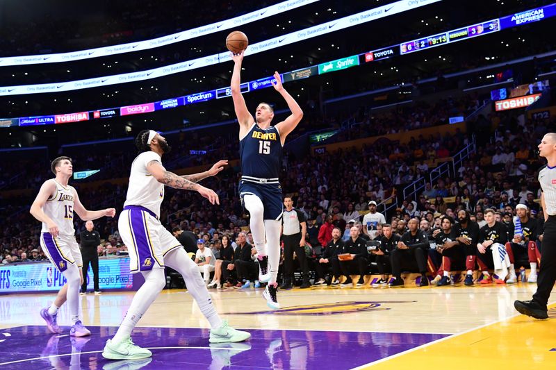 LOS ANGELES, CA - APRIL 27: Nikola Jokic #15 of the Denver Nuggets drives to the basket during the game against the Los Angeles Lakers during Round 1 Game 4 of the 2024 NBA Playoffs on April 27, 2024 at Crypto.Com Arena in Los Angeles, California. NOTE TO USER: User expressly acknowledges and agrees that, by downloading and/or using this Photograph, user is consenting to the terms and conditions of the Getty Images License Agreement. Mandatory Copyright Notice: Copyright 2024 NBAE (Photo by Adam Pantozzi/NBAE via Getty Images)