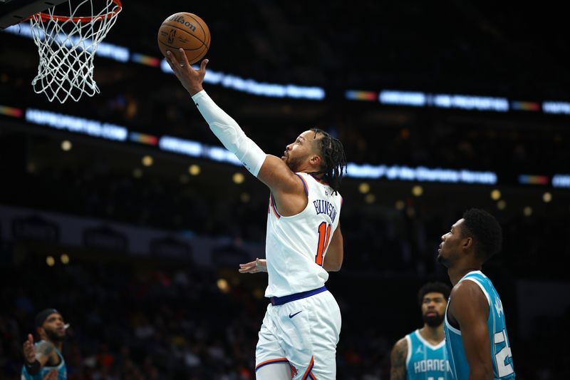 CHARLOTTE, NORTH CAROLINA - JANUARY 29: Jalen Brunson #11 of the New York Knicks attempts a lay up during the second half of the game against the Charlotte Hornets at Spectrum Center on January 29, 2024 in Charlotte, North Carolina. NOTE TO USER: User expressly acknowledges and agrees that, by downloading and or using this photograph, User is consenting to the terms and conditions of the Getty Images License Agreement. (Photo by Jared C. Tilton/Getty Images)