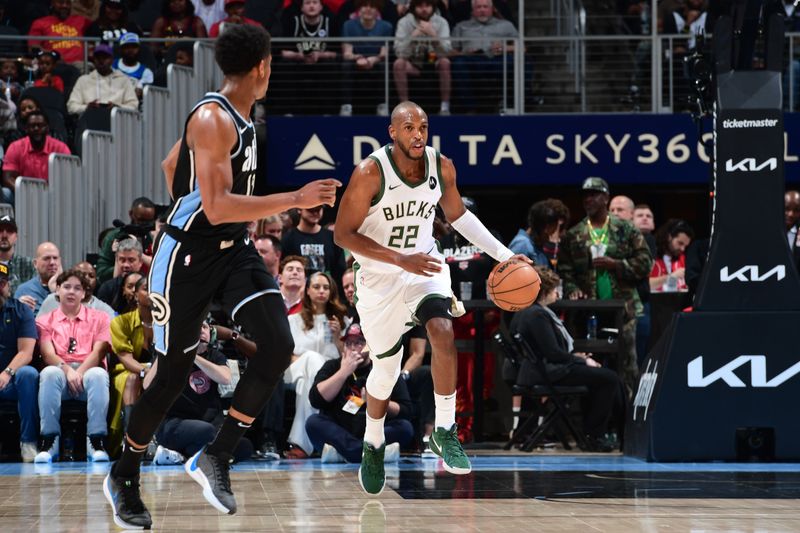 ATLANTA, GA - MARCH 30: Khris Middleton #22 of the Milwaukee Bucks dribbles the ball during the game against the Atlanta Hawks on March 30, 2024 at State Farm Arena in Atlanta, Georgia.  NOTE TO USER: User expressly acknowledges and agrees that, by downloading and/or using this Photograph, user is consenting to the terms and conditions of the Getty Images License Agreement. Mandatory Copyright Notice: Copyright 2024 NBAE (Photo by Scott Cunningham/NBAE via Getty Images)