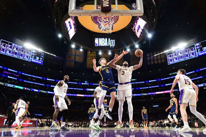 LOS ANGELES, CA - MACH 16: Anthony Davis #3 of the Los Angeles Lakers rebounds the ball during the game against the Golden State Warriors on March 16, 2024 at Crypto.Com Arena in Los Angeles, California. NOTE TO USER: User expressly acknowledges and agrees that, by downloading and/or using this Photograph, user is consenting to the terms and conditions of the Getty Images License Agreement. Mandatory Copyright Notice: Copyright 2024 NBAE (Photo by Adam Pantozzi/NBAE via Getty Images)