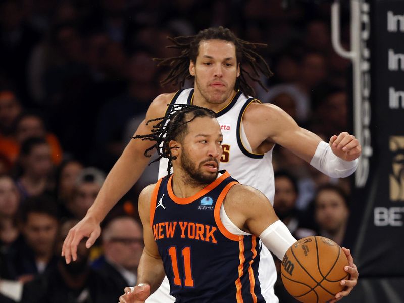 NEW YORK, NEW YORK - JANUARY 25: Jalen Brunson #11 of the New York Knicks dribbles as Aaron Gordon #50 of the Denver Nuggets defends during the first half at Madison Square Garden on January 25, 2024 in New York City. NOTE TO USER: User expressly acknowledges and agrees that, by downloading and/or using this Photograph, user is consenting to the terms and conditions of the Getty Images License Agreement. (Photo by Sarah Stier/Getty Images)