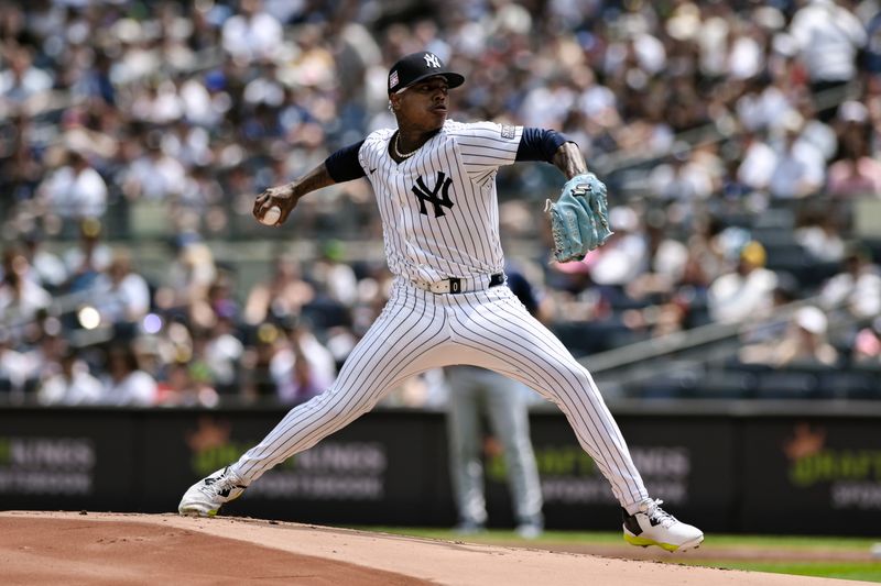 Jul 21, 2024; Bronx, New York, USA; New York Yankees pitcher Marcus Stroman (0) throws against the Tampa Bay Rays during the first inning at Yankee Stadium. Mandatory Credit: John Jones-USA TODAY Sports