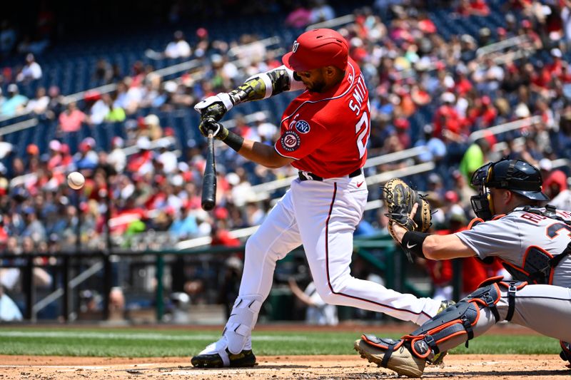 May 21, 2023; Washington, District of Columbia, USA; Washington Nationals first baseman Dominic Smith (22) hits a RBI fielders choice against the Detroit Tigers during the first inning at Nationals Park. Mandatory Credit: Brad Mills-USA TODAY Sports