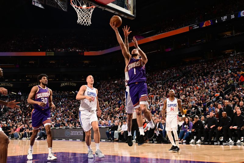 PHOENIX, AZ - APRIL  9:  Devin Booker #1 of the Phoenix Suns drives to the basket during the game against the LA Clippers on April 9, 2024 at Footprint Center in Phoenix, Arizona. NOTE TO USER: User expressly acknowledges and agrees that, by downloading and or using this photograph, user is consenting to the terms and conditions of the Getty Images License Agreement. Mandatory Copyright Notice: Copyright 2024 NBAE (Photo by Kate Frese/NBAE via Getty Images)