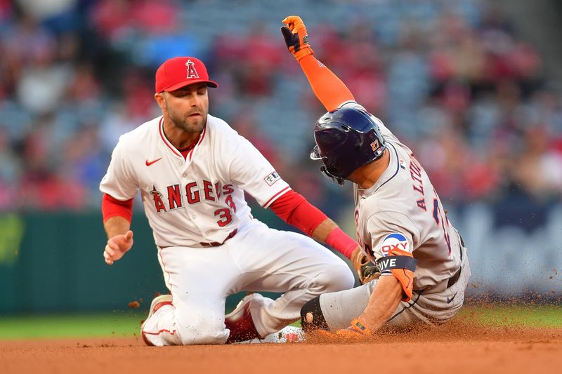 Sep 13, 2024; Anaheim, California, USA; Houston Astros second baseman Jose Altuve (27) is out at second by Los Angeles Angels designated hitter Charles Leblanc (33) during the first inning at Angel Stadium. Mandatory Credit: Gary A. Vasquez-Imagn Images