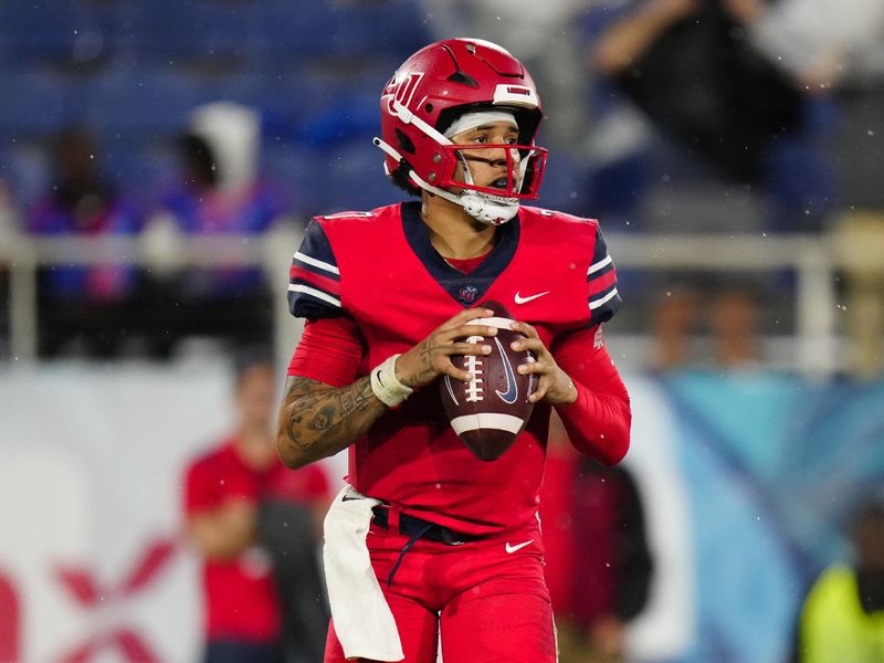 Dec 20, 2022; Boca Raton, Florida, USA; Liberty Flames quarterback Kaidon Salter (7) drops back to pass against the Toledo Rockets during the second quarter in the 2022 Boca Raton Bowl at FAU Stadium. Mandatory Credit: Rich Storry-USA TODAY Sports