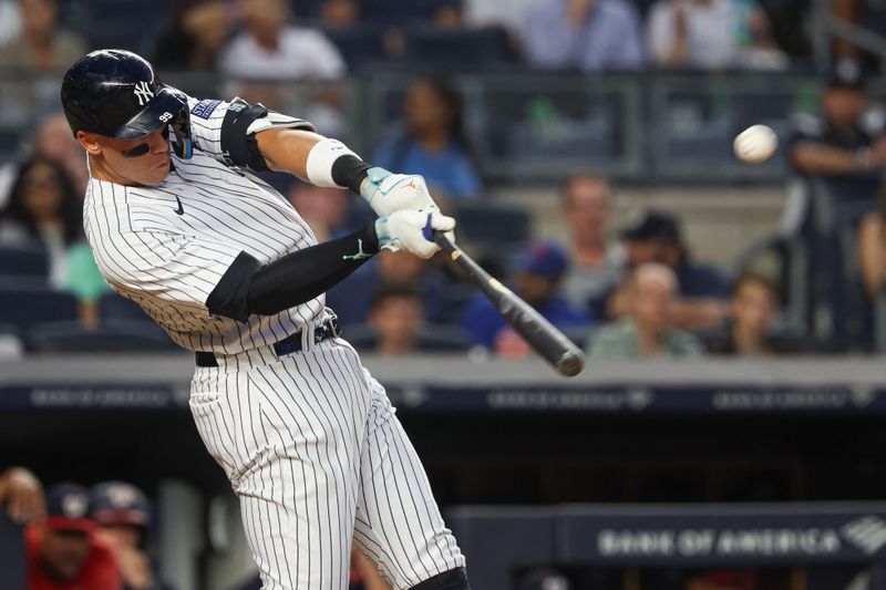 Aug 23, 2023; Bronx, New York, USA; New York Yankees right fielder Aaron Judge (99) hits a grand slam home run during the second inning against the Washington Nationals at Yankee Stadium. Mandatory Credit: Vincent Carchietta-USA TODAY Sports