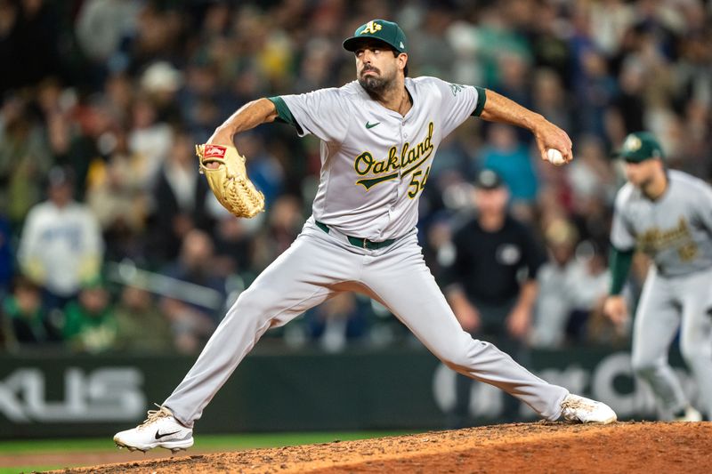 Sep 28, 2024; Seattle, Washington, USA; Oakland Athletics reliever Scott Alexander (54) delivers a pitch during the tenth inning against the Seattle Mariners at T-Mobile Park. Mandatory Credit: Stephen Brashear-Imagn Images