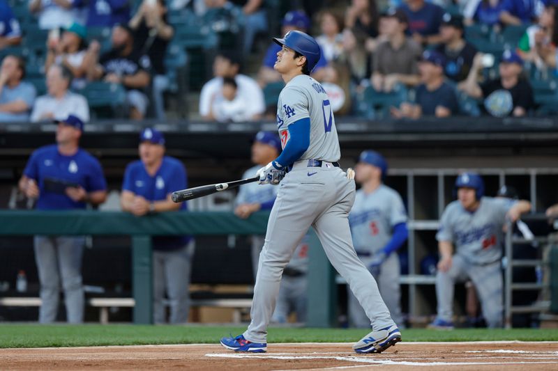 Jun 26, 2024; Chicago, Illinois, USA; Los Angeles Dodgers designated hitter Shohei Ohtani (17) watches his solo home run against the Chicago White Sox during the first inning at Guaranteed Rate Field. Mandatory Credit: Kamil Krzaczynski-USA TODAY Sports