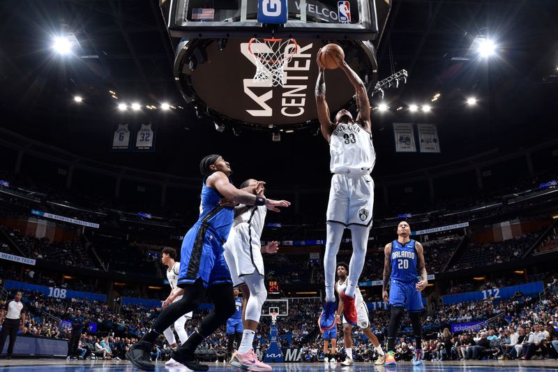 ORLANDO, FL - FEBRUARY 27: Nicolas Claxton #33 of the Brooklyn Nets grabs a rebound during the game against the Orlando Magic on February 27, 2024 at the Kia Center in Orlando, Florida. NOTE TO USER: User expressly acknowledges and agrees that, by downloading and or using this photograph, User is consenting to the terms and conditions of the Getty Images License Agreement. Mandatory Copyright Notice: Copyright 2024 NBAE (Photo by Fernando Medina/NBAE via Getty Images)