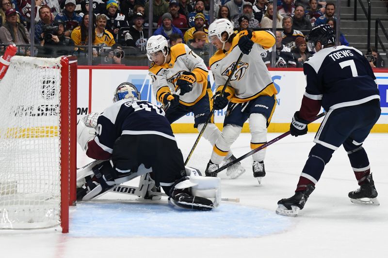 Nov 11, 2024; Denver, Colorado, USA; Colorado Avalanche goaltender Alexandar Georgiev (40) makes a save against Nashville Predators right wing Luke Evangelista (77) during the first period at Ball Arena. Mandatory Credit: Christopher Hanewinckel-Imagn Images