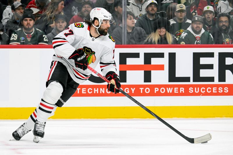 Nov 29, 2024; Saint Paul, Minnesota, USA;  Chicago Blackhawks forward Pat Maroon (77) controls the puck against the Minnesota Wild during the second period at Xcel Energy Center. Mandatory Credit: Nick Wosika-Imagn Images