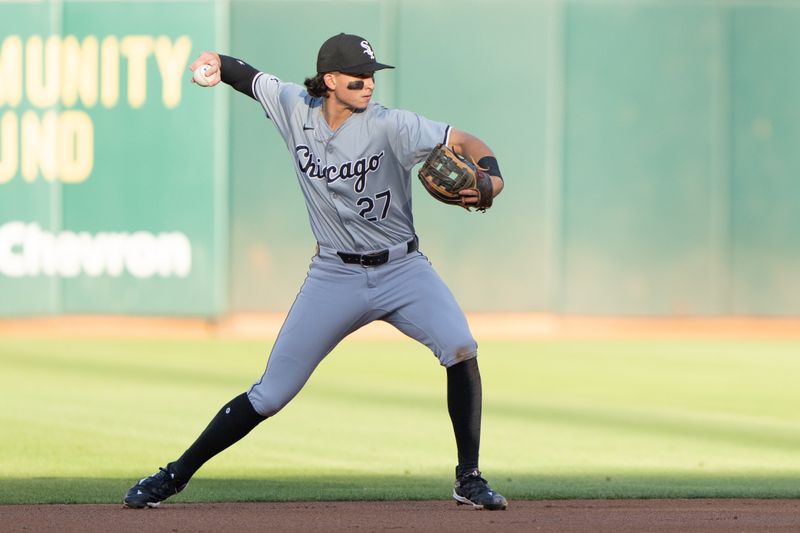 Aug 6, 2024; Oakland, California, USA;  Chicago White Sox shortstop Brooks Baldwin (27) throws the ball during the first inning against the Oakland Athletics at Oakland-Alameda County Coliseum. Mandatory Credit: Stan Szeto-USA TODAY Sports