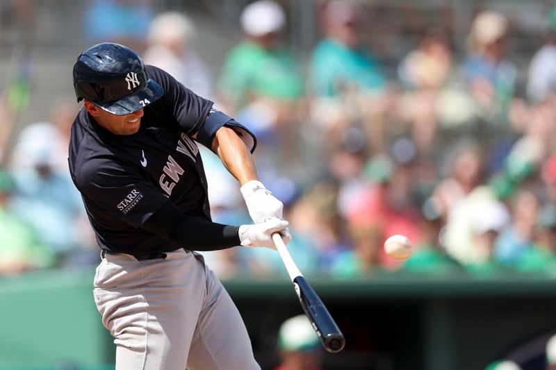 Mar 17, 2024; Fort Myers, Florida, USA;  New York Yankees short stop Kevin Smith (74) hits a three rbi triple against the Boston Red Sox in the fourth inning at JetBlue Park at Fenway South. Mandatory Credit: Nathan Ray Seebeck-USA TODAY Sports