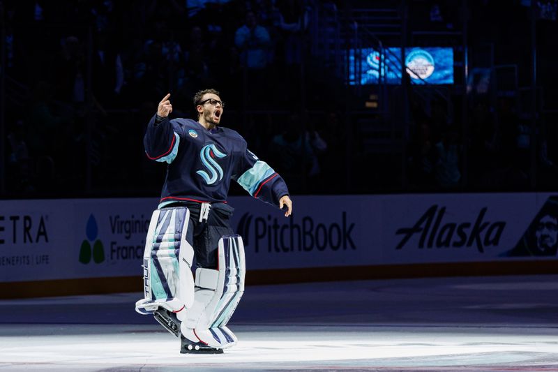 Oct 19, 2024; Seattle, Washington, USA; Seattle Kraken goaltender Joey Daccord (35) waves to the crowd after the overtime victory against the Calgary Flames at Climate Pledge Arena. Mandatory Credit: Caean Couto-Imagn Images