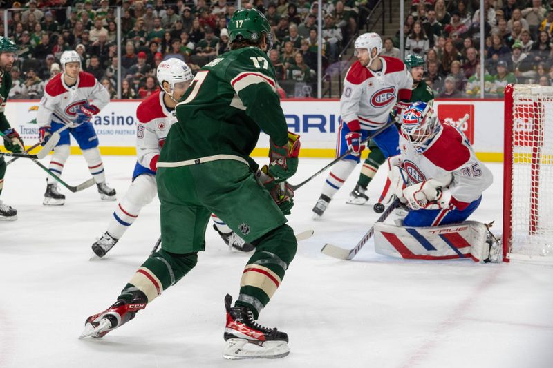 Dec 21, 2023; Saint Paul, Minnesota, USA; Montreal Canadiens goaltender Sam Montembeault (35) makes a save against Minnesota Wild left wing Marcus Foligno (17) in the first period at Xcel Energy Center. Mandatory Credit: Matt Blewett-USA TODAY Sports