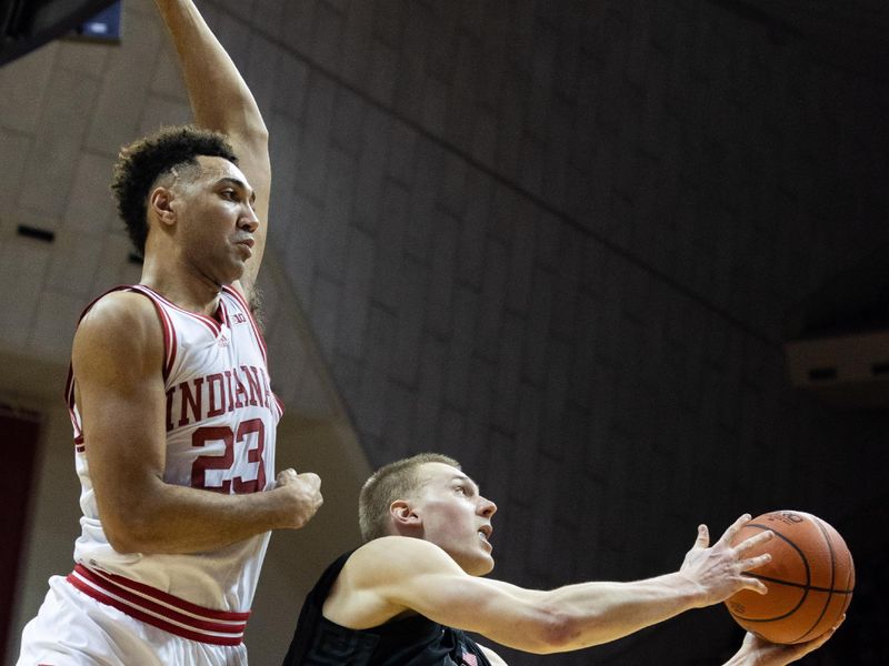 Jan 22, 2023; Bloomington, Indiana, USA; Michigan State Spartans forward Joey Hauser (10) shoots the ball while Indiana Hoosiers forward Trayce Jackson-Davis (23) defends in the second half at Simon Skjodt Assembly Hall. Mandatory Credit: Trevor Ruszkowski-USA TODAY Sports