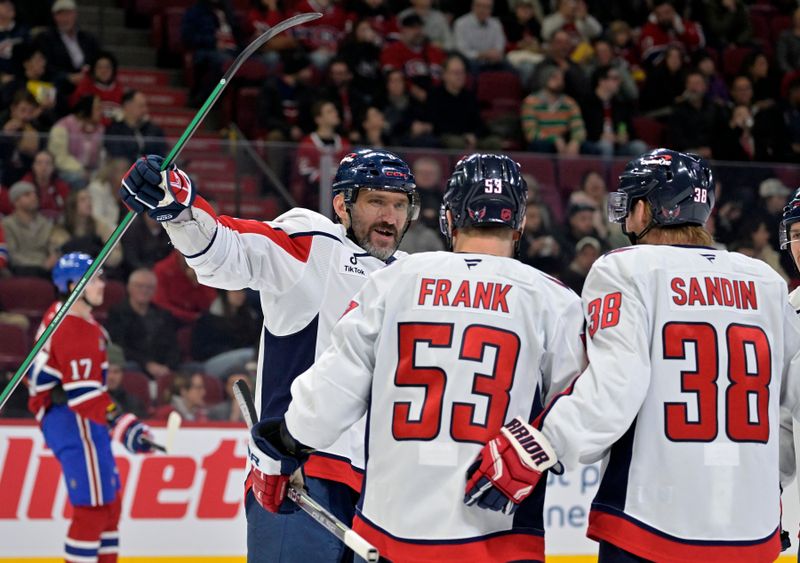 Nov 20, 2025; Montreal, Quebec, CAN; Washington Capitals forward Ethen Frank (53) celebrates with teammates forward Alex Ovechkin (8) and defenseman Rasmus Sandin (38) after scoring a goal against the Montreal Canadiens during the second period at the Bell Centre. Mandatory Credit: Eric Bolte-Imagn Images
