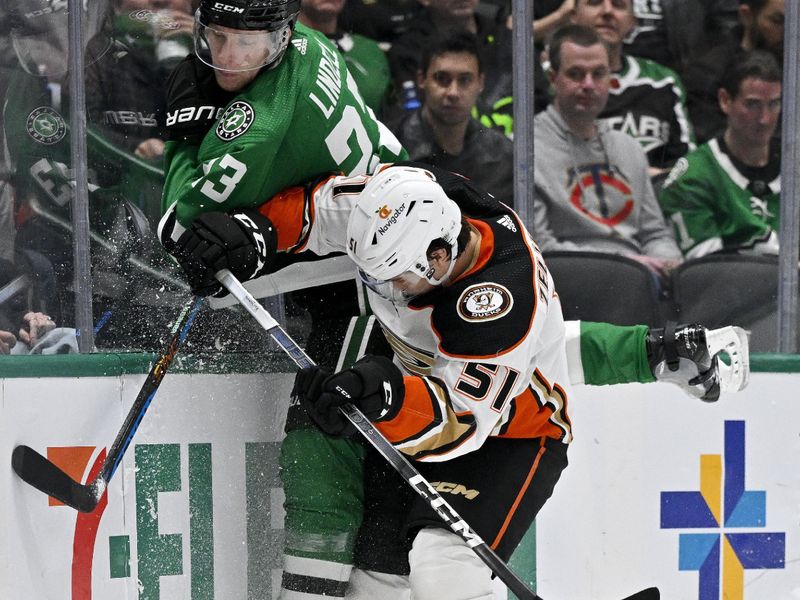 Jan 25, 2024; Dallas, Texas, USA; Anaheim Ducks defenseman Olen Zellweger (51) checks Dallas Stars defenseman Esa Lindell (23) during the third period at the American Airlines Center. Mandatory Credit: Jerome Miron-USA TODAY Sports