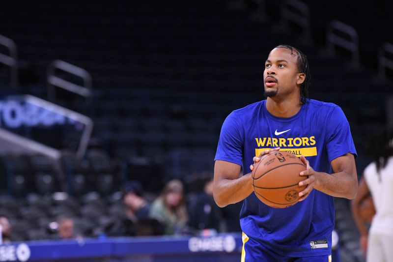 SAN FRANCISCO, CA - NOVEMBER 7: Moses Moody #4 of the Golden State Warriors warms up before the game against the Sacramento Kings on November 7, 2022 at Chase Center in San Francisco, California. NOTE TO USER: User expressly acknowledges and agrees that, by downloading and or using this photograph, user is consenting to the terms and conditions of Getty Images License Agreement. Mandatory Copyright Notice: Copyright 2022 NBAE (Photo by Noah Graham/NBAE via Getty Images)