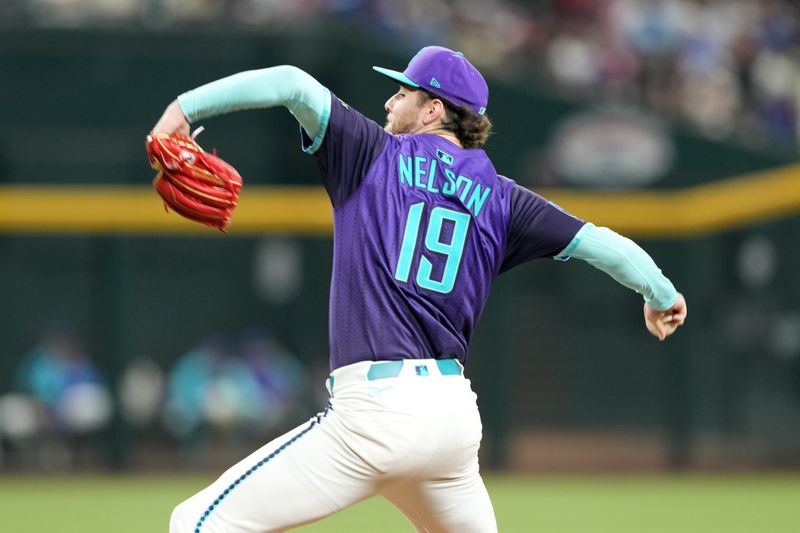 May 10, 2025; Phoenix, Arizona, USA; Arizona Diamondbacks pitcher Ryne Nelson (19) pitches against the Los Angeles Dodgers during the ninth inning at Chase Field. Mandatory Credit: Joe Camporeale-Imagn Images