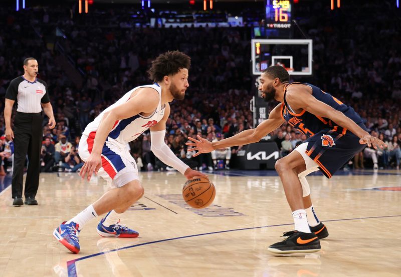 NEW YORK, NEW YORK - APRIL 21: Cade Cunningham #2 of the Detroit Pistons makes a move on Mikal Bridges #25 of the New York Knicks during the second quarter in Game Two of the Eastern Conference First Round NBA Playoffs at Madison Square Garden on April 21, 2025 in New York City. NOTE TO USER: User expressly acknowledges and agrees that, by downloading and or using this photograph, User is consenting to the terms and conditions of the Getty Images License Agreement. (Photo by Al Bello/Getty Images)