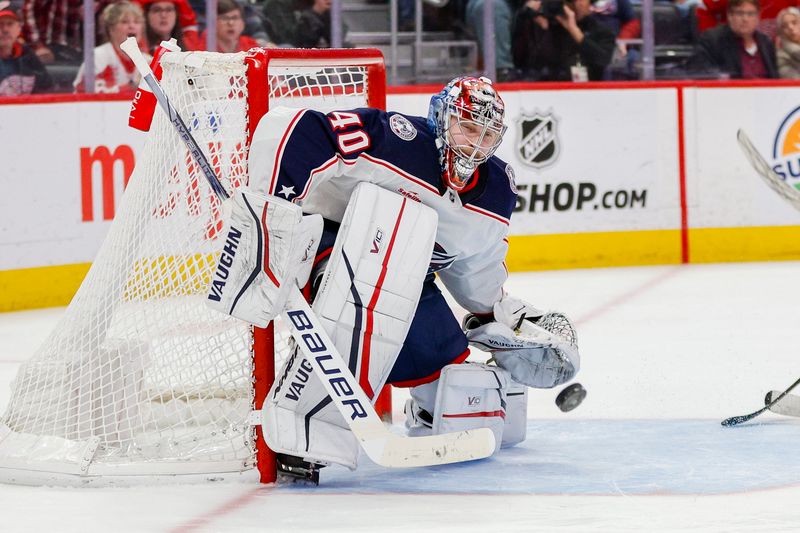 Mar 19, 2024; Detroit, Michigan, USA; Columbus Blue Jackets goaltender Daniil Tarasov (40) attempts to block a shot during the third period of the game against the Detroit Red Wings at Little Caesars Arena. Mandatory Credit: Brian Bradshaw Sevald-USA TODAY Sports