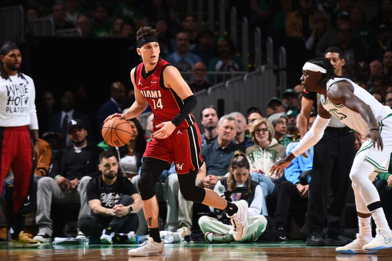 BOSTON, MA - APRIL 21: Tyler Herro #14 of the Miami Heat dribbles the ball during the game against the Boston Celtics during Round 1 Game 1 of the 2024 NBA Playoffs on April 21, 2024 at the TD Garden in Boston, Massachusetts. NOTE TO USER: User expressly acknowledges and agrees that, by downloading and or using this photograph, User is consenting to the terms and conditions of the Getty Images License Agreement. Mandatory Copyright Notice: Copyright 2024 NBAE  (Photo by Brian Babineau/NBAE via Getty Images)