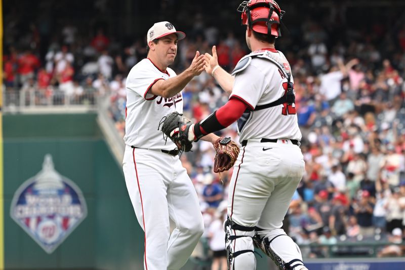 Jul 4, 2024; Washington, District of Columbia, USA; Washington Nationals relief pitcher Derek Law (58) celebrates with catcher Riley Adams (15) after defeating the New York Mets during the ninth inning at Nationals Park. Mandatory Credit: Rafael Suanes-USA TODAY Sports