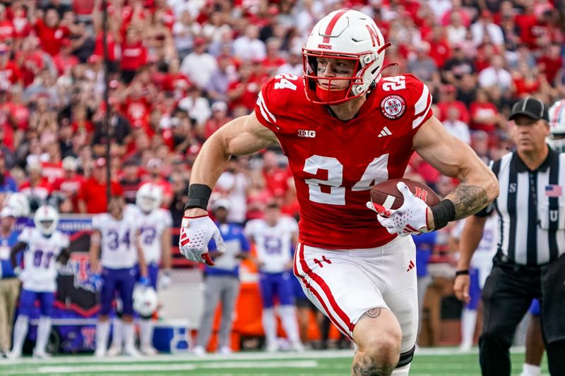 Sep 23, 2023; Lincoln, Nebraska, USA; Nebraska Cornhuskers tight end Thomas Fidone II (24) runs for a touchdown against the Louisiana Tech Bulldogs during the fourth quarter at Memorial Stadium. Mandatory Credit: Dylan Widger-USA TODAY Sports