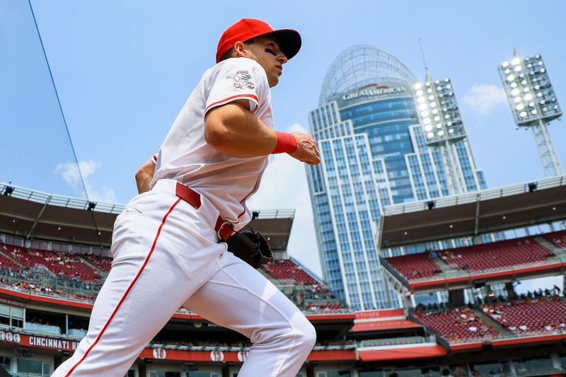 Jun 4, 2025; Cincinnati, Ohio, USA; Cincinnati Reds first baseman Spencer Steer (7) runs onto the field before the game against the Milwaukee Brewers at Great American Ball Park. Mandatory Credit: Katie Stratman-Imagn Images