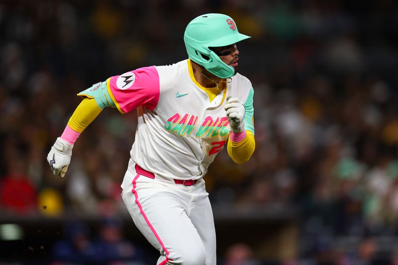 Apr 25, 2025; San Diego, California, USA; San Diego Padres left fielder Tirso Ornelas (21) singles to record his first career MLB hit during the fifth inning against the Tampa Bay Rays at Petco Park. Mandatory Credit: Chadd Cady-Imagn Images