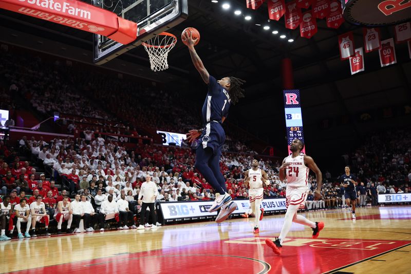 Jan 31, 2024; Piscataway, New Jersey, USA; Penn State Nittany Lions guard Ace Baldwin Jr. (1) goes up for a basket during the first half in front of Rutgers Scarlet Knights guard Austin Williams (24) and forward Aundre Hyatt (5) at Jersey Mike's Arena. Mandatory Credit: Vincent Carchietta-USA TODAY Sports