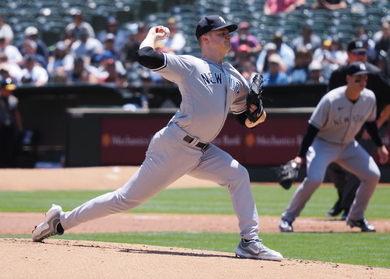 Jun 29, 2023; Oakland, California, USA; New York Yankees starting pitcher Clarke Schmidt (36) pitches the ball against the Oakland Athletics during the first inning at Oakland-Alameda County Coliseum. Mandatory Credit: Kelley L Cox-USA TODAY Sports