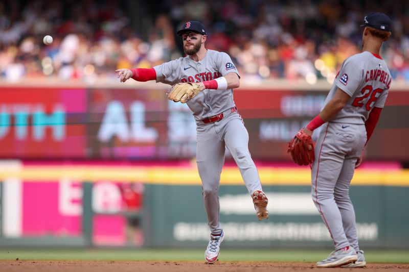 May 31, 2025; Atlanta, Georgia, USA; Boston Red Sox shortstop Trevor Story (10) throws a runner out at first against the Atlanta Braves in the seventh inning at Truist Park. Mandatory Credit: Brett Davis-Imagn Images