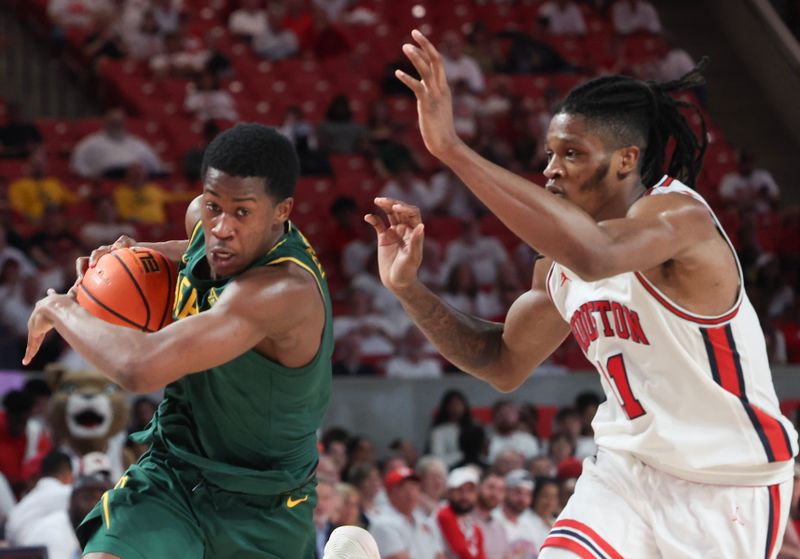 Feb 10, 2025; Houston, Texas, USA; Baylor Bears forward Josh Ojianwuna (17) drives to basket against Houston Cougars forward Joseph Tugler (11)  in the second half at Fertitta Center. Mandatory Credit: Thomas Shea-Imagn Images