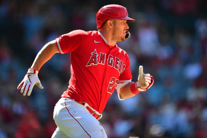 Jun 29, 2023; Anaheim, California, USA; Los Angeles Angels center fielder Mike Trout (27) runs after hitting a single against the Chicago White Sox during the ninth inning at Angel Stadium. Mandatory Credit: Gary A. Vasquez-USA TODAY Sports