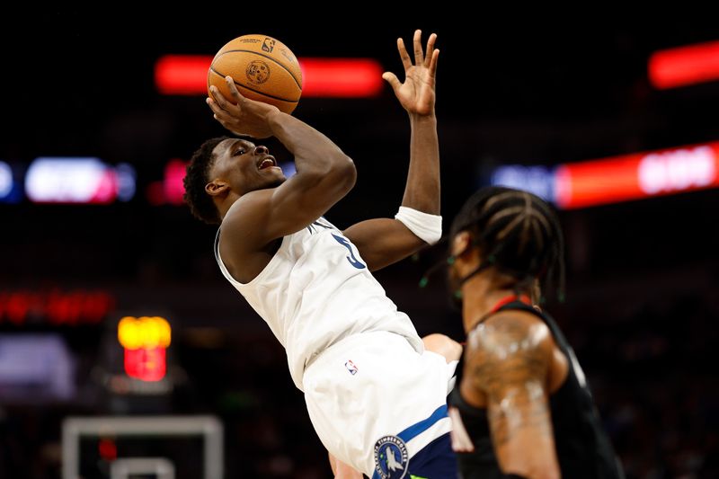 MINNEAPOLIS, MINNESOTA - FEBRUARY 04: Anthony Edwards #5 of the Minnesota Timberwolves shoots the ball against the Houston Rockets in the fourth quarter at Target Center on February 04, 2024 in Minneapolis, Minnesota. The Timberwolves defeated the Rockets 111-90. NOTE TO USER: User expressly acknowledges and agrees that, by downloading and or using this photograph, User is consenting to the terms and conditions of the Getty Images License Agreement. (Photo by David Berding/Getty Images)