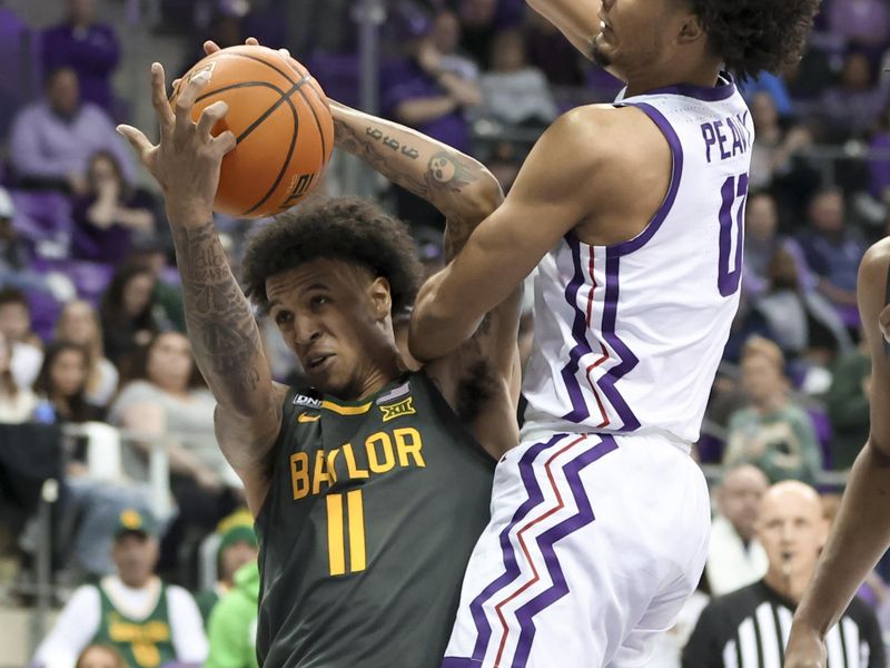 Feb 11, 2023; Fort Worth, Texas, USA;  Baylor Bears forward Jalen Bridges (11) controls the ball as TCU Horned Frogs guard Micah Peavy (0) defends during the second half at Ed and Rae Schollmaier Arena. Mandatory Credit: Kevin Jairaj-USA TODAY Sports