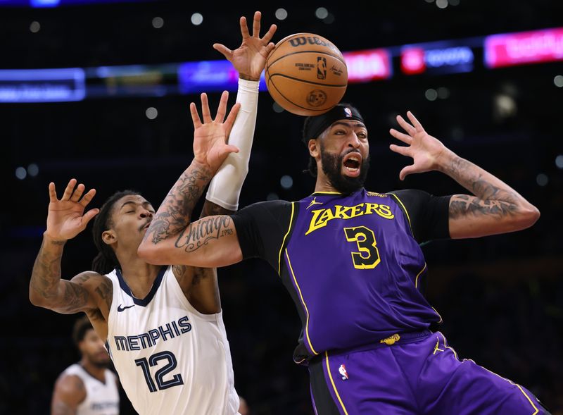 LOS ANGELES, CALIFORNIA - JANUARY 05: Anthony Davis #3 of the Los Angeles Lakers reacts as he is stripped of the ball by Ja Morant #12 of the Memphis Grizzlies during the first half at Crypto.com Arena on January 05, 2024 in Los Angeles, California. User is consenting to the terms and conditions of the Getty Images License Agreement. (Photo by Harry How/Getty Images)