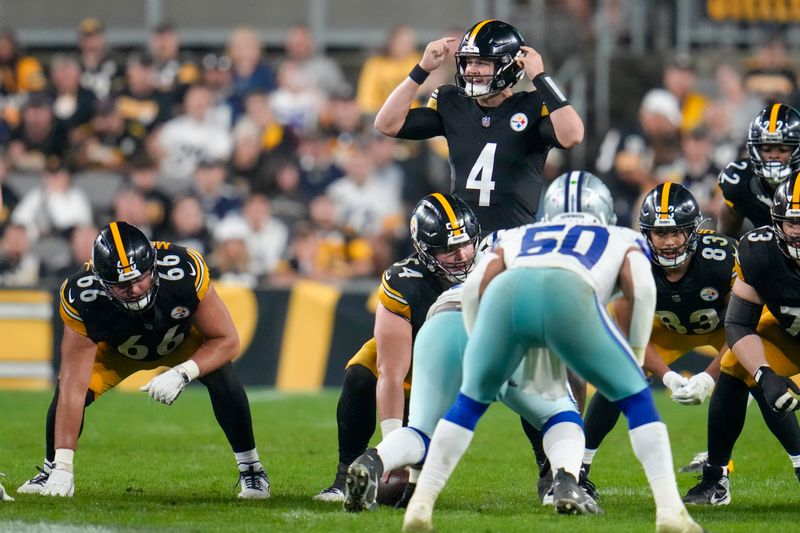 Pittsburgh Steelers quarterback Kyle Allen (4) calls a play during the second half of an NFL football game against the Dallas Cowboys, Sunday, Oct. 6, 2024, in Pittsburgh. (AP Photo/Gene J. Puskar)