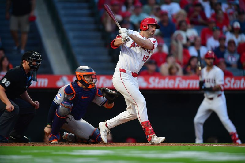 Sep 13, 2024; Anaheim, California, USA; Los Angeles Angels first baseman Nolan Schanuel (18) hits a single against the Houston Astros during the first inning at Angel Stadium. Mandatory Credit: Gary A. Vasquez-Imagn Images