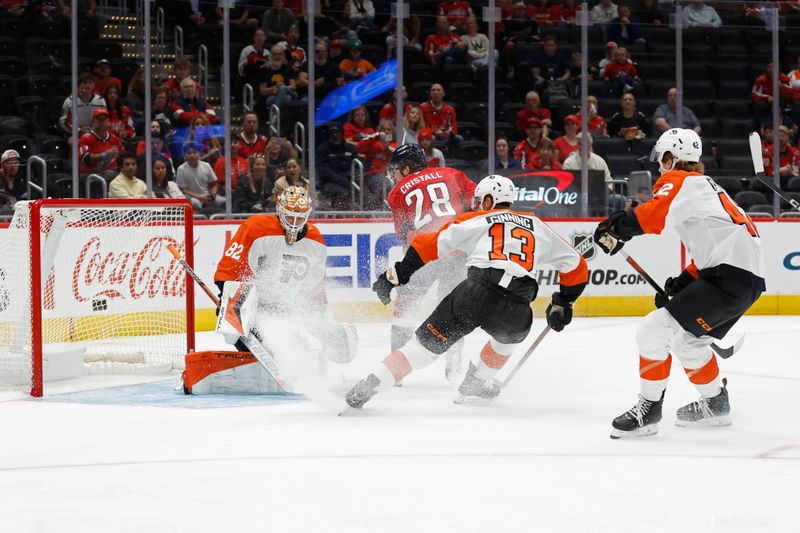 Sep 22, 2024; Washington, District of Columbia, USA; Philadelphia Flyers goaltender Ivan Fedotov (82) makes a save on Washington Capitals defenseman Andrew Cristall (28) as Flyers defenseman Adam Ginning (13) defends in the first period at Capital One Arena. Mandatory Credit: Geoff Burke-Imagn Images