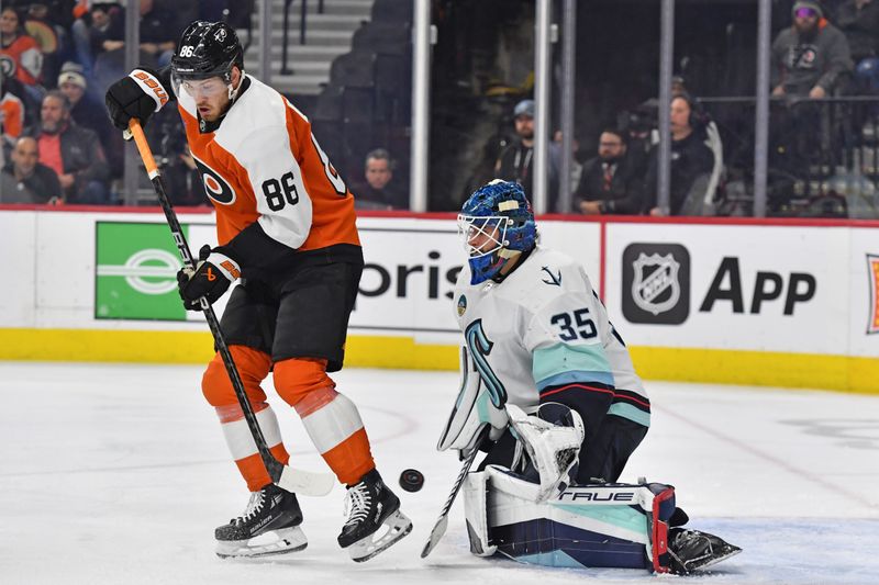 Feb 10, 2024; Philadelphia, Pennsylvania, USA; Seattle Kraken goaltender Joey Daccord (35) makes a save while being screened by Philadelphia Flyers left wing Joel Farabee (86) during the third period at Wells Fargo Center. Mandatory Credit: Eric Hartline-USA TODAY Sports