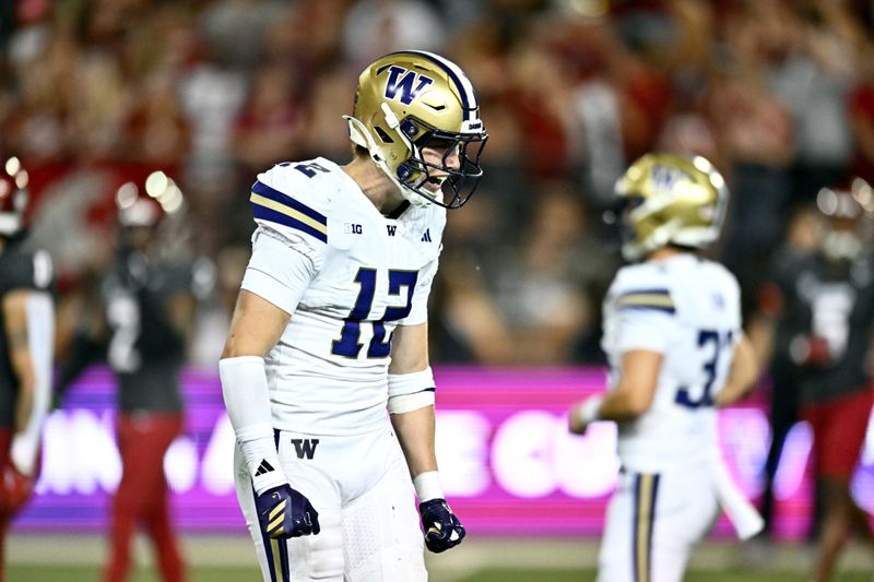 Sep 20, 2025; Pullman, Washington, USA; Washington Huskies safety Alex McLaughlin (12) celebrates after a touchdown against the Washington State Cougars in the second half of Apple Cup at Gesa Field at Martin Stadium. Washington Huskies won 59-24. Mandatory Credit: James Snook-Imagn Images