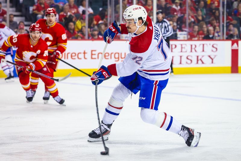 Mar 16, 2024; Calgary, Alberta, CAN; Montreal Canadiens defenseman Arber Xhekaj (72) shoots the puck against the Calgary Flames during the first period at Scotiabank Saddledome. Mandatory Credit: Sergei Belski-USA TODAY Sports