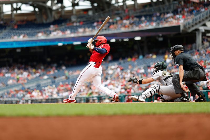 Aug 13, 2023; Washington, District of Columbia, USA; Washington Nationals left fielder Stone Garrett (36) hits an RBI double against the Oakland Athletics during the first inning at Nationals Park. Mandatory Credit: Geoff Burke-USA TODAY Sports