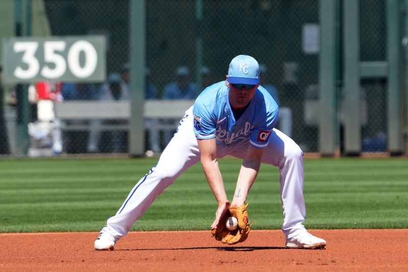 Mar 13, 2024; Surprise, Arizona, USA; Kansas City Royals third baseman CJ Alexander (72) fields a ground ball against the Los Angeles Angels during the first inning at Surprise Stadium. Mandatory Credit: Joe Camporeale-USA TODAY Sports