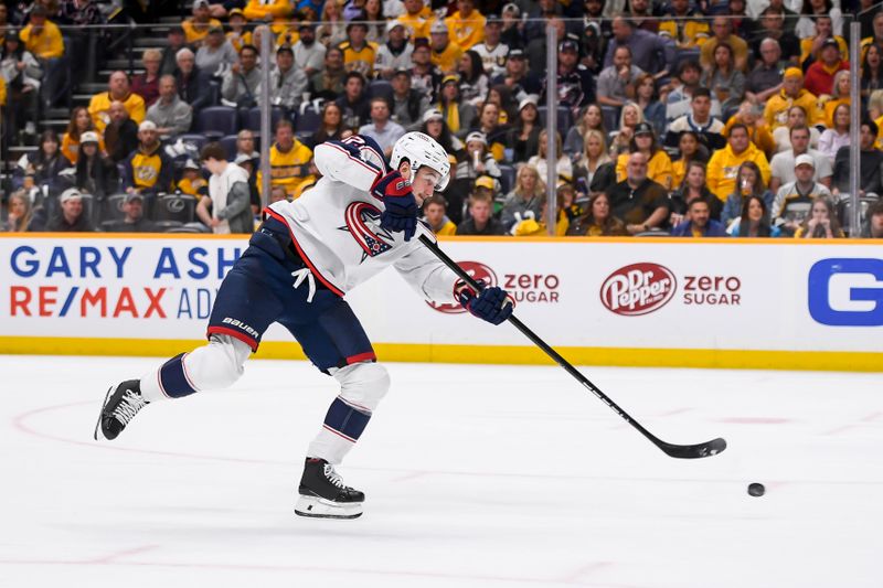 Apr 13, 2024; Nashville, Tennessee, USA; Columbus Blue Jackets center Alexandre Texier (42) shoots and scores against the Nashville Predators during the second period at Bridgestone Arena. Mandatory Credit: Steve Roberts-USA TODAY Sports