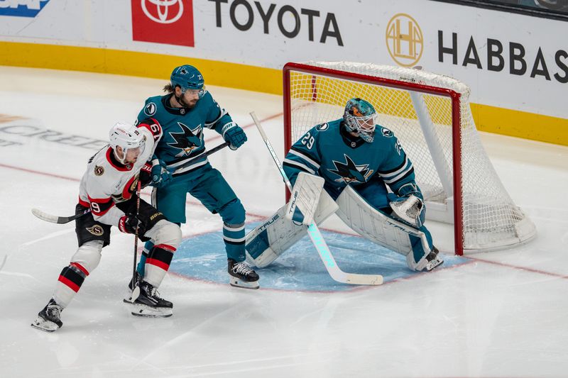 Nov 27, 2024; San Jose, California, USA; San Jose Sharks defenseman Timothy Liljegren (37) and Ottawa Senators right wing Drake Batherson (19) battle for position in front of the net during the second period at SAP Center at San Jose. Mandatory Credit: Neville E. Guard-Imagn Images